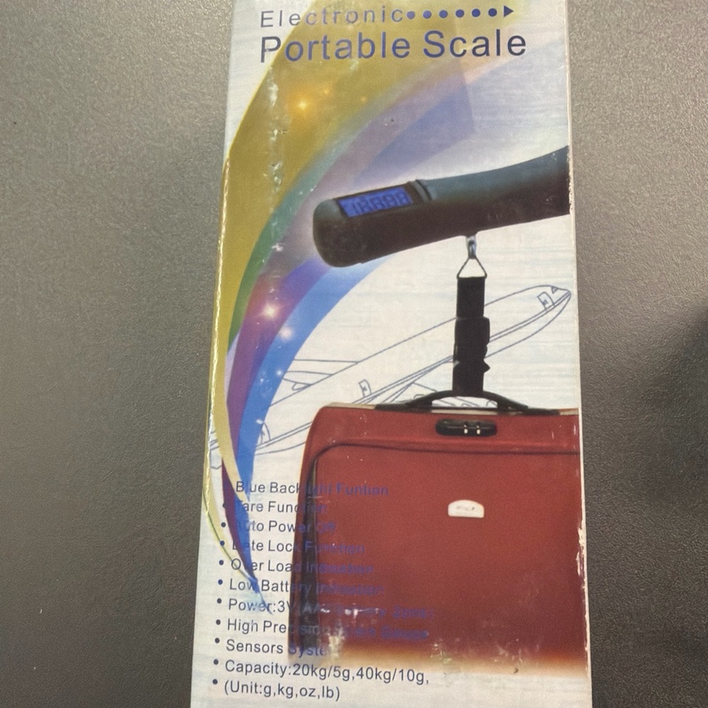 Portable travel electronic digital hanging luggage scale.